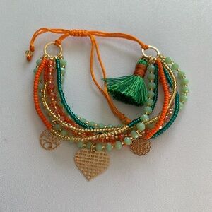 Kristyland multi layer adjustable charm bracelet.